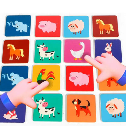 Colorful animal matching game with cartoon farm animals and two hands pointing at tiles