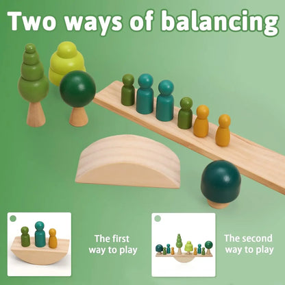 Wooden balancing toy set with figures, trees, and seesaw on a green background